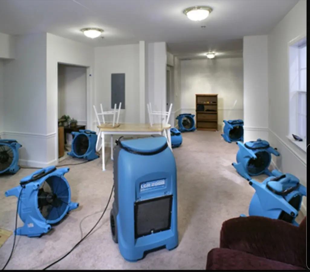Air movers and dehumidifier setup for Water Damage Restoration in Barton